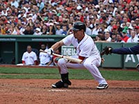 A Red Sox batter playing a bunt (© Parkerjh, CC-BY-3.0)