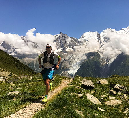 A runner runs on a high-altitude route in Chamonix, France