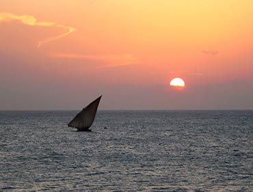 A dhow in the sunset off the Zanzibar coast