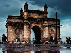 The Gateway of India is an impressive yellow basalt monument