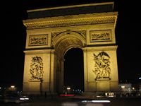 The Arc de Triomphe at night.