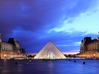 The modern pyramid outside Paris' Louvre (© Martin Falbisoner, distributed under a CCASA3.0 Unported licence).